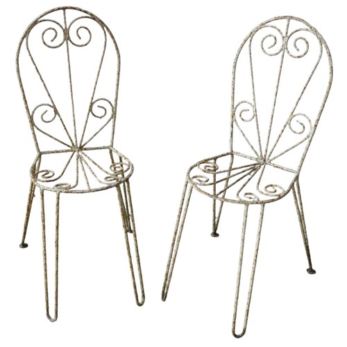 125 - A PAIR OF WROUGHT IRON GARDEN CHAIRS, MID 20TH CENTURY, good weathered appearance, scroll decorated ... 