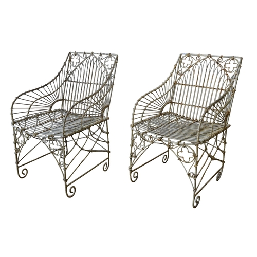 131 - A PAIR OF VINTAGE WIRE WORK GARDEN CHAIRS, arch decorated back panel with quatrefoil emblems, flanke... 