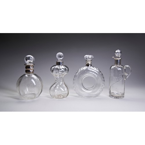 769 - A MIXED GROUP OF FOUR GLASS DECANTERS, 20TH CENTURY, including a novelty whisky decanter modelled as... 