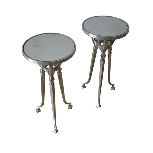 15 - A PAIR OF CONTEMPORARY MIRROR TOP STANDS, the circular top inset with distressed plates, raised on c... 