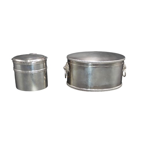 800 - TWO OVAL FORM SILVER BOXES, the larger box flanked with lion mask handles and a gadrooned rim (Sheff... 