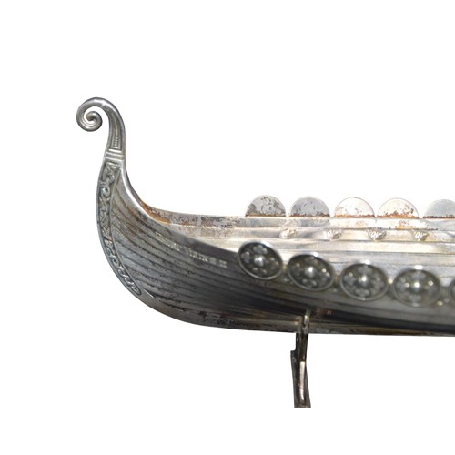 811 - A NORWEGIAN SILVER PLATED MODEL OF A VIKING LONGBOAT, the side of the boat engraved 'Henry Viking II... 