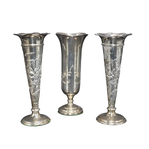 803 - A PAIR OF EDWARDIAN SILVER SPILL VASES, tapering trumpet form with repousse floral decoration, raise... 