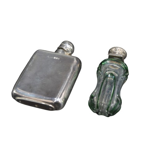 808 - A VICTORIAN SILVER HIP FLASK AND SILVER MOUNTED SCENT BOTTLE, the hip flask with chased armorial dec... 