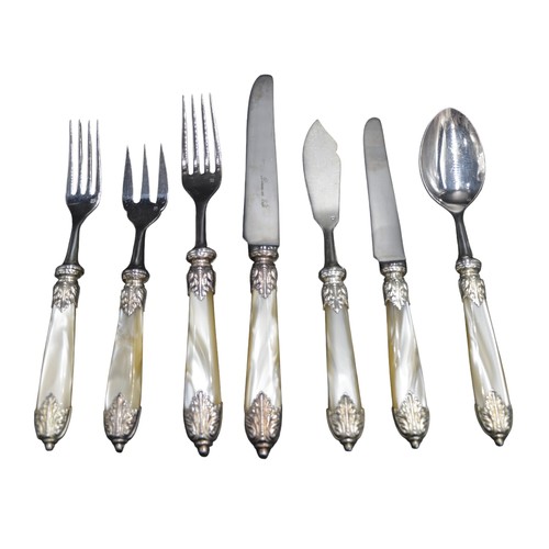 830 - A NEAR SET OF VINTAGE FRENCH 'DINERS EN VILLE' CUTLERY, faux mother of pearl handles with ornate scr... 