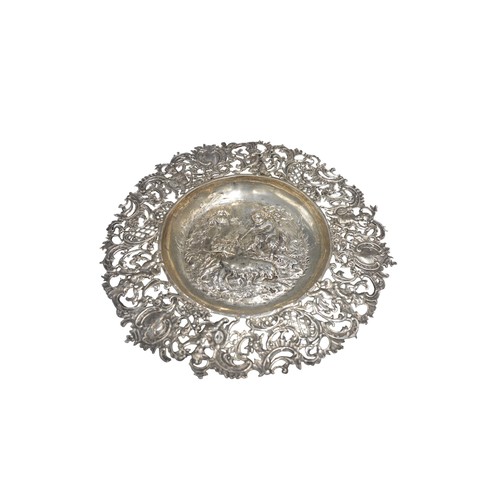 450A - 19TH CENTURY HANAU SILVER DISH, having pierced Rococo border and central embossed well depicting sat... 