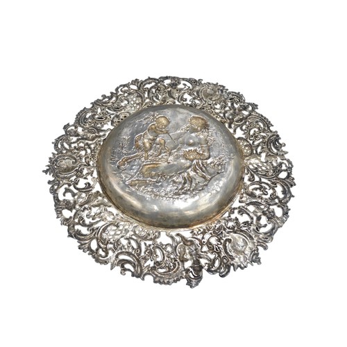 450A - 19TH CENTURY HANAU SILVER DISH, having pierced Rococo border and central embossed well depicting sat... 