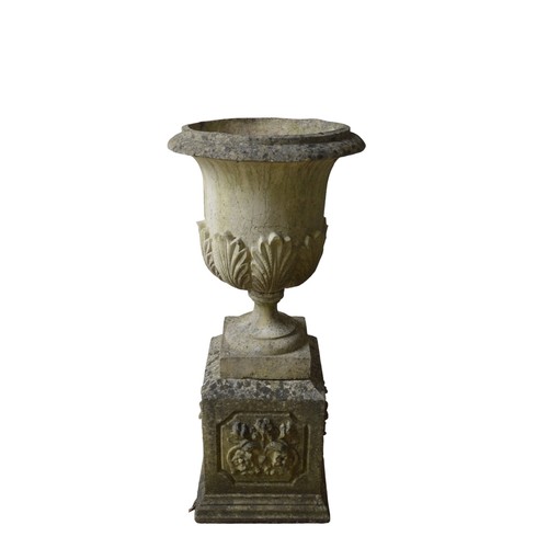 135 - A LARGE RECONSTITUTED STONE URN ON PLINTH, in three sections, good weathered appearance130 cm high, ... 