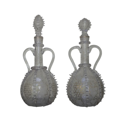 298 - A NEAR PAIR OF DUTCH SPIRIT DECANTERS, 19TH CENTURY, the slender neck and globular sides with acid e... 