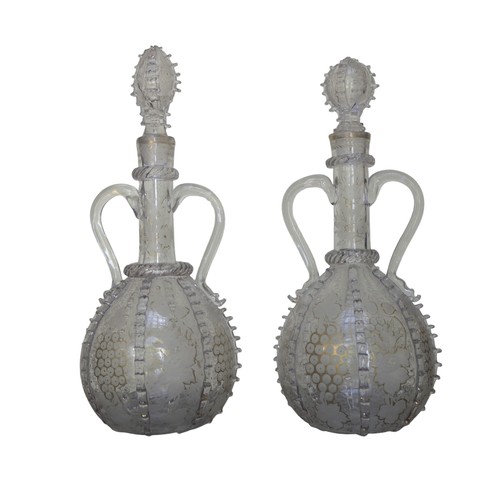 298 - A NEAR PAIR OF DUTCH SPIRIT DECANTERS, 19TH CENTURY, the slender neck and globular sides with acid e... 