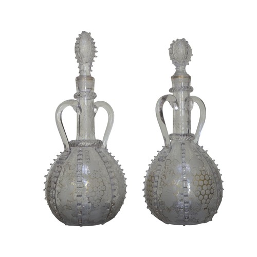 298 - A NEAR PAIR OF DUTCH SPIRIT DECANTERS, 19TH CENTURY, the slender neck and globular sides with acid e... 