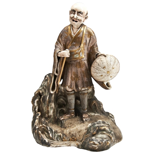 115 - A LARGE JAPANESE SATSUMA FIGUREMEIJI PERIOD (1868-1912)modelled as elderly man standing on a rockwor... 