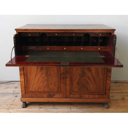 27 - AN EARLY 19TH CENTURY CROSSBANDED MAHOGANY SECRETAIRE CUPBOARD, the long frieze drawer opening to re... 