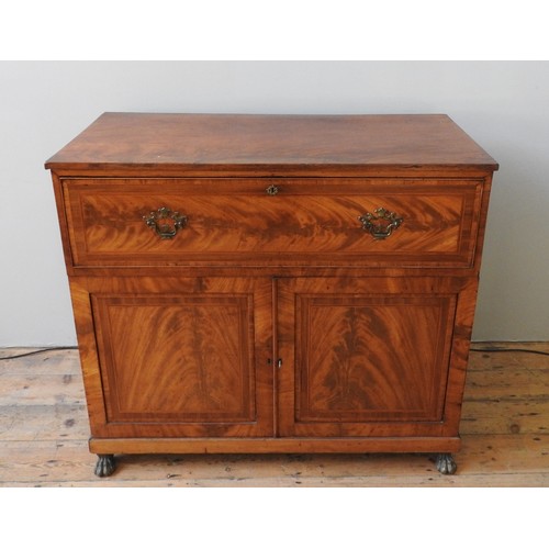 27 - AN EARLY 19TH CENTURY CROSSBANDED MAHOGANY SECRETAIRE CUPBOARD, the long frieze drawer opening to re... 