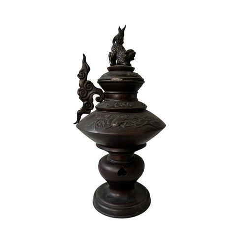 103 - A JAPANESE BRONZE KORO, turned baluster form with two handles, the lid decorated with guardian lion