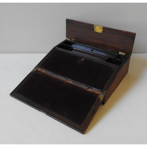 507 - A 19TH CENTURY CROSS BANDED MAHOGANY WRITING SLOPE, the brass inlay bi-fold lid opening to reveal a ... 