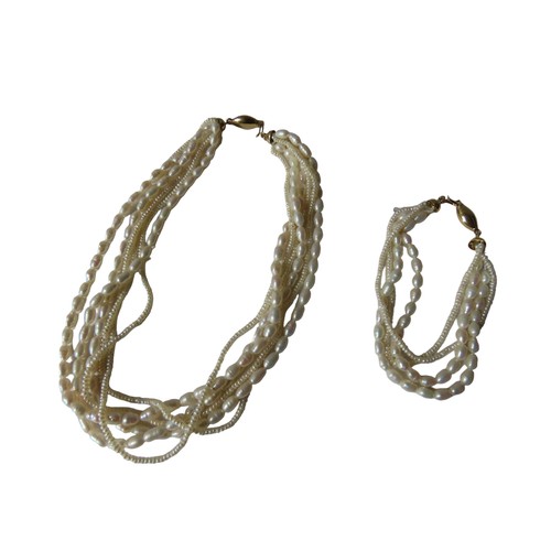 540 - A MULTI-STRAND FRESH WATER PEARL NECKLACE, with an 18ct gold clasp, together with a matching bracele... 