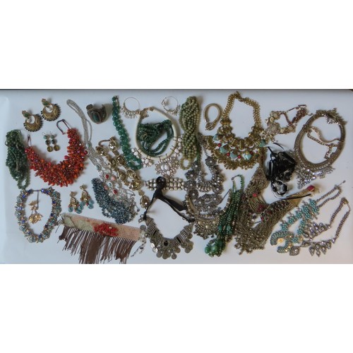 524 - A LARGE COLLECTION OF COSTUME JEWELLERY heavily bejewelled including Indian pieces, hardstone neckla... 