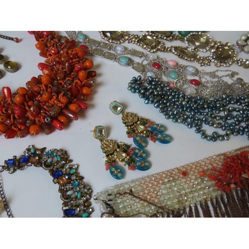 524 - A LARGE COLLECTION OF COSTUME JEWELLERY heavily bejewelled including Indian pieces, hardstone neckla... 