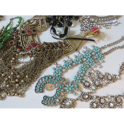 524 - A LARGE COLLECTION OF COSTUME JEWELLERY heavily bejewelled including Indian pieces, hardstone neckla... 