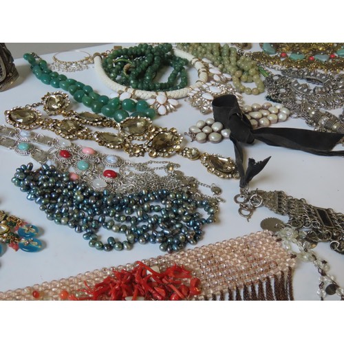 524 - A LARGE COLLECTION OF COSTUME JEWELLERY heavily bejewelled including Indian pieces, hardstone neckla... 