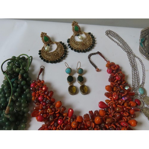 524 - A LARGE COLLECTION OF COSTUME JEWELLERY heavily bejewelled including Indian pieces, hardstone neckla... 