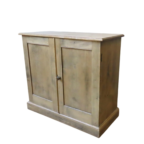 24 - A VINTAGE PINE SIDE CUPBOARD, plain rectangular form with twin panelled doors enclosing two interior... 