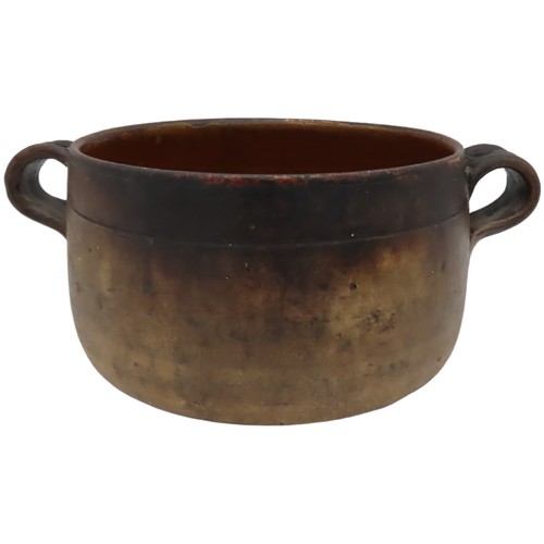 303 - TWO VINTAGE VALLAURIS EARTHENWARE COOKING POTS, with glazed interiors and applied ring handles, both... 