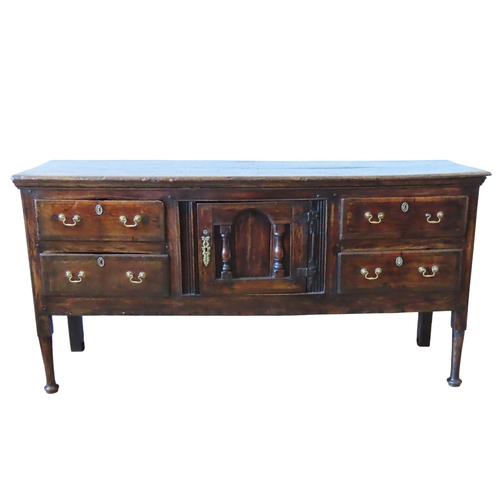 71 - AN ELM AND CROSSBANDED DRESSER BASE, 18TH CENTURY, rectangular top over a central arch panelled cupb... 