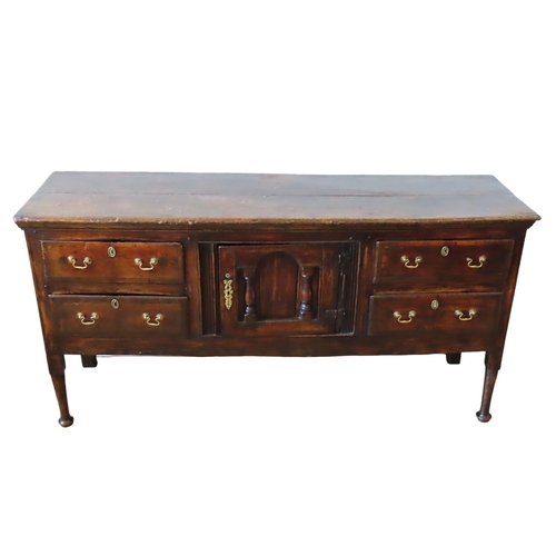 71 - AN ELM AND CROSSBANDED DRESSER BASE, 18TH CENTURY, rectangular top over a central arch panelled cupb... 