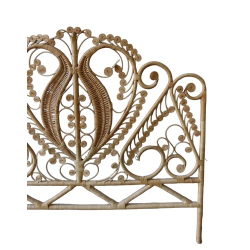 28 - A VINTAGE 'BOHO' RATTAN HEADBOARD, ornate scrolling peacock pattern122cm x 137cm