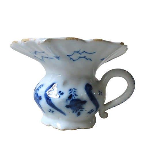 304 - AN UNUSUAL DELFT CUSPIDOR, MID 18TH CENTURY, with a flared hexagonal undulating rim, waisted body wi... 