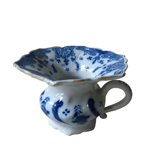 304 - AN UNUSUAL DELFT CUSPIDOR, MID 18TH CENTURY, with a flared hexagonal undulating rim, waisted body wi... 