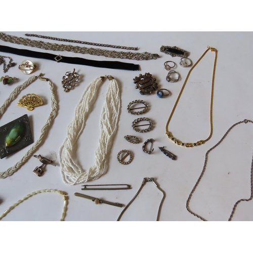 527 - A MIXED GROUP OF COSTUME JEWELLERY, the lot includes a snake bangle, silver crucifix on chain, and n... 