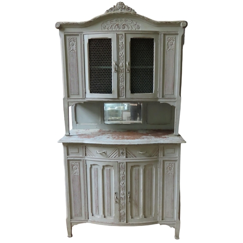 36 - A VINTAGE FRENCH BUFFET CABINET, in two sections, the top consisting of carved arch pediment over tw... 