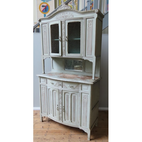 36 - A VINTAGE FRENCH BUFFET CABINET, in two sections, the top consisting of carved arch pediment over tw... 