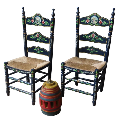 13 - A PAIR OF PAINTED PINE 'NARROW BOAT' STYLE CHAIRS, the ladder backs painted with floral and figural ... 