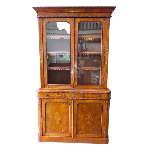 64 - A VICTORIAN BURR WALNUT BOOKCASE CUPBOARD, in two sections, the top section consisting of a gadroone... 