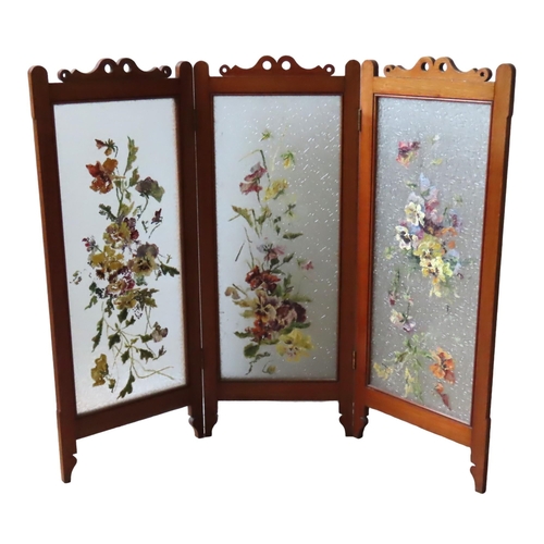 56 - A LATE 19TH CENTURY MAHOGANY TRIPLE FOLDING SCREEN, each panel inset with textured frosted glass wit... 