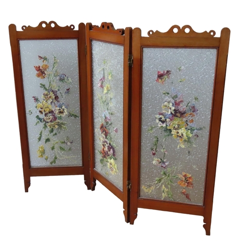 56 - A LATE 19TH CENTURY MAHOGANY TRIPLE FOLDING SCREEN, each panel inset with textured frosted glass wit... 