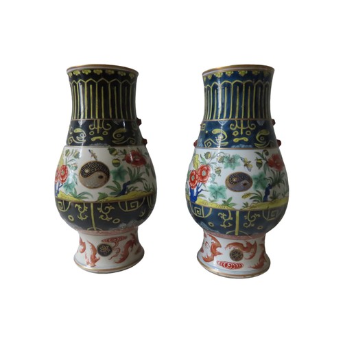 171 - A PAIR OF CHINESE 'CLOBBERED' BALUSTER VASES 19TH/20TH CENTURY24cm high