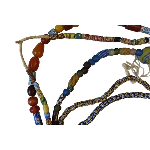 544 - A MIXED GROUP OF FIVE VENETIAN GLASS AFRICAN TRADE BEAD NECKLACES, with millefiore beads and others