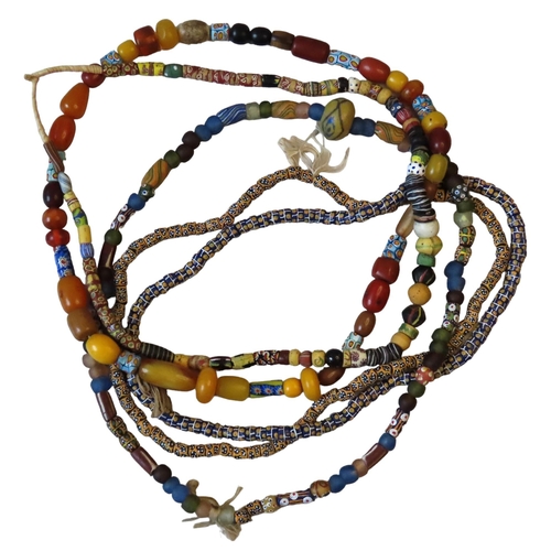 544 - A MIXED GROUP OF FIVE VENETIAN GLASS AFRICAN TRADE BEAD NECKLACES, with millefiore beads and others