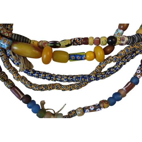 544 - A MIXED GROUP OF FIVE VENETIAN GLASS AFRICAN TRADE BEAD NECKLACES, with millefiore beads and others