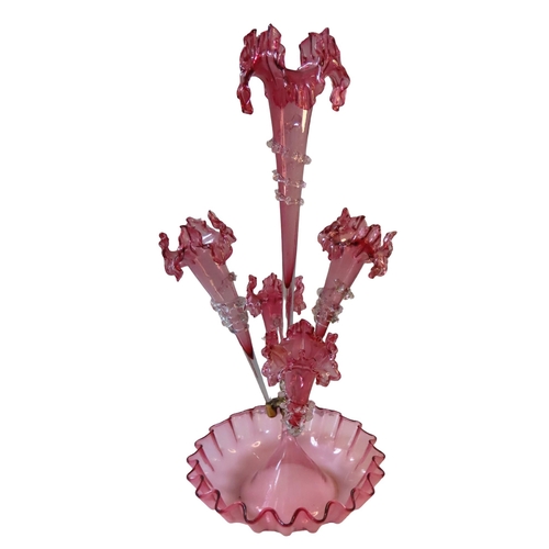 313 - A 19TH CENTURY CRANBERRY GLASS EPERGNE, the crimped edge base surmounted by a central tapering stem ... 