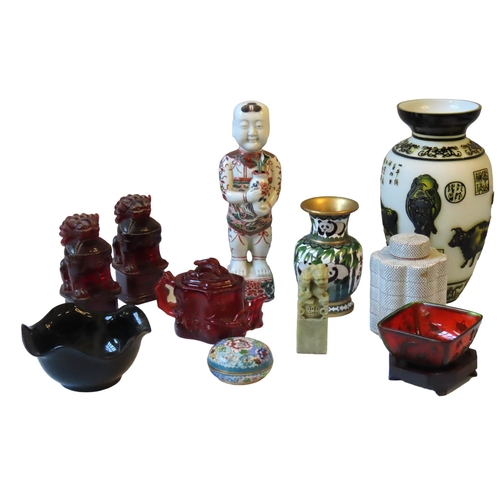 169 - A FAUX AMBER TEAPOT, two faux amber lions, a modern cloisonne vase decorated with pandas, a modern C... 