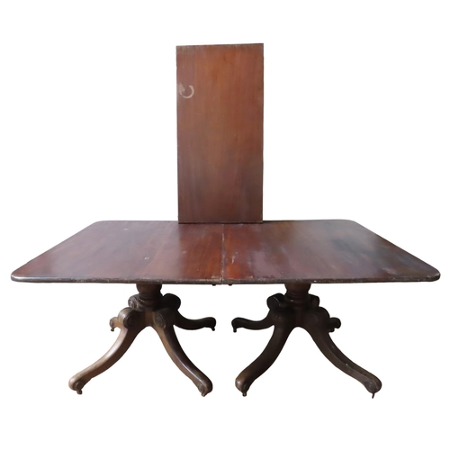 70 - A 19TH CENTURY MAHOGANY TWIN PEDESTAL DINING TABLE, the rectangular top comprised of two tilt-top se... 