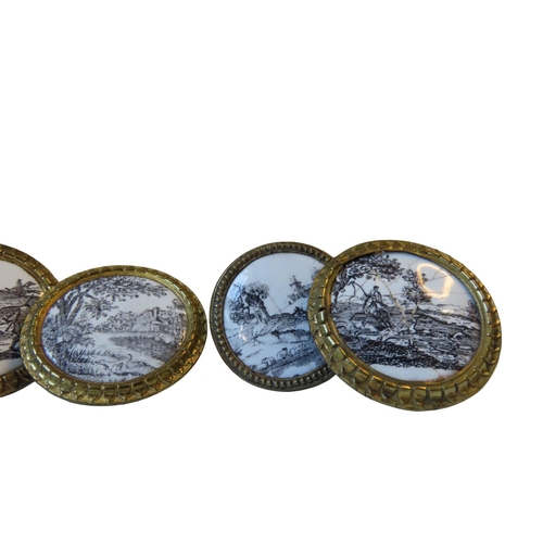 600 - A SET OF FIVE FRENCH ENAMELLED GILT BRASS HANDLES, decorated with black and white hunting scenes and... 