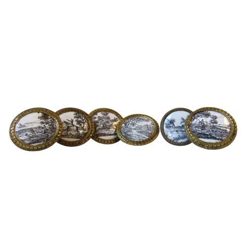 600 - A SET OF FIVE FRENCH ENAMELLED GILT BRASS HANDLES, decorated with black and white hunting scenes and... 