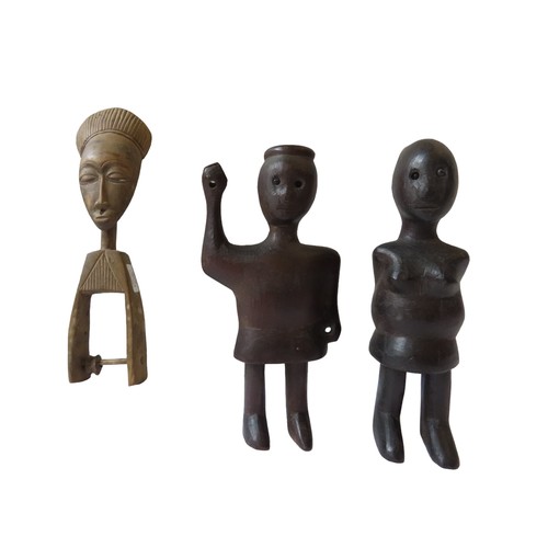 90 - A HEDDLE PULLEY, IVORY COAST, 20th century and two carved wooden figures.28 cms max